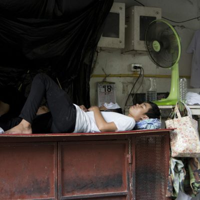 Restaurant workers sleep under a fan during a break in central Bangkok, Thailand, Wednesday, April 27, 2016. April in Thailand is typically hot and sweaty but this year's scorching weather has set a record for the longest heat wave in at least 65 years. (AP Photo/Mark Baker)