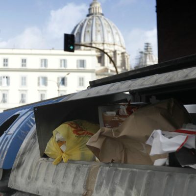 Trash overflows from garbage bins, in Rome, in this photo taken on Wednesday, Jan. 17, 2018. On March 4, Italians will cast ballots for Parliament, a national election that will also help determine their new government. Rome's mayor isn't running at all, but that detail hasn't stopped politicians from transforming the city's chronic trash problem into a big campaign trail issue. (AP Photo/Gregorio Borgia)