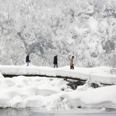 Visitors walk over a snow covered bridge in the national park of Plitvice, Croatia, Friday, March 2, 2018. Most of Croatia was heavily hit by the recent unusually cold weather that gripped Europe. (AP Photo/Darko Bandic)