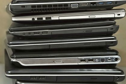 2CMX68N stack of old laptops awaiting repair. Image shot 11/2019. Exact date unknown.