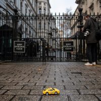 Greenpeace UK activists drove remote-control electric toy cars under the security gates of Downing Street and down towards Number 10 in a demonstration urging the UK Prime Minister to back a 2030 ban on new petrol, diesel and hybrid vehicles.