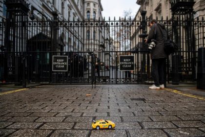 Greenpeace UK activists drove remote-control electric toy cars under the security gates of Downing Street and down towards Number 10 in a demonstration urging the UK Prime Minister to back a 2030 ban on new petrol, diesel and hybrid vehicles.