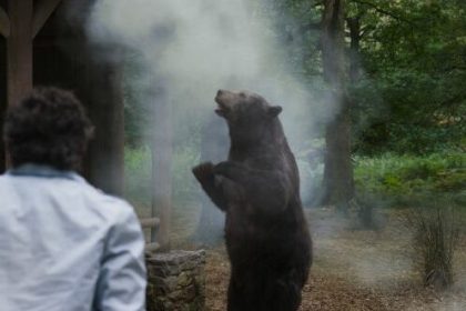 (from left, back to camera) Eddie (Alden Ehrenreich) and Stache (Aaron Holliday) in Cocaine Bear, directed by Elizabeth Banks.