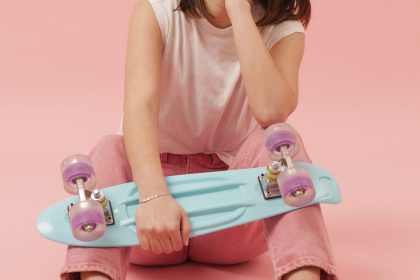 girl-chewing-gum-holding-skateboard