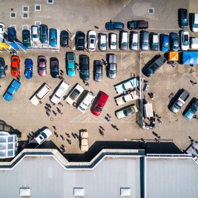 photo-from-above-of-vehicles-parked-near-building-753876