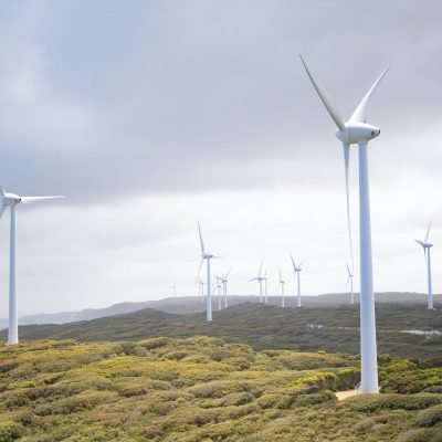 photo-of-wind-turbines-under-cloudy-sky-3619870
