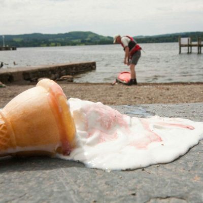 An ice cream melting on the shores of Lake Windermere Cumbria UK during a summer heat wave All the climate modelling shows that many areas of the planet will suffer from more frequent and more severe heat waves as a result of climate change which wiull result in the deaths of many people,Image: 50432416, License: Rights-managed, Restrictions: , Model Release: no