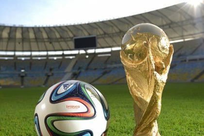 Brazuca by Adidas, official match ball of the 2014 FIFA World Cup in Brazil, next to the World Cup trophy at the Estádio do Maracanã, Rio de Janeiro, Brazil,Image: 181754664, License: Rights-managed, Restrictions: , Model Release: no