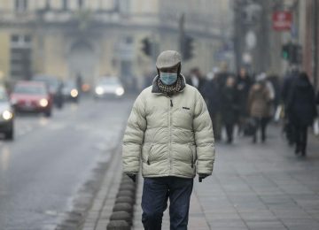 SARAJEVO, BOSNIA AND HERZEGOVINA - DECEMBER 11: People walk on a street as fog of polluted air covers the city due to intense air pollution showing its effects during winter in Sarajevo, Bosnia and Herzegovina on December 11, 2023. Samir Jordamovic / Anadolu,Image: 828805653, License: Rights-managed, Restrictions: , Model Release: no